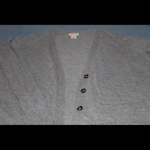 I’m selling a grey, long sleeve, button up sweater